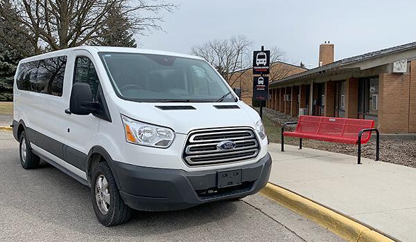 Shuttle bus to North Campus parked outside the visitor center